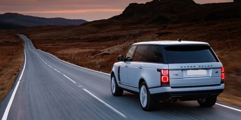 A Range Rover driving down a road